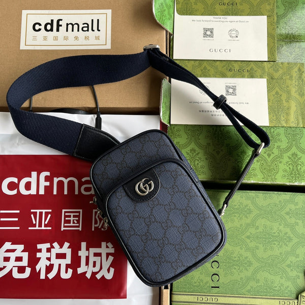 OPHIDIA MINI BAG 18 AUS DUNKELBLAUEM MONOGRAMM-CANVAS UND SCHWARZEM LAMMFELLBESATZ