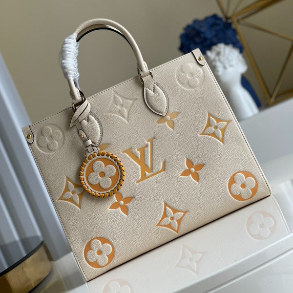 LV ONTHEGO MM 35 CREME RINDSLEDERBESCHMUCK 
