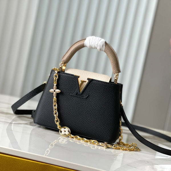 CAPUCINES MINI 21 IN SCHWARZ MIX WEISS TAURILLON GOLD HARDWARE