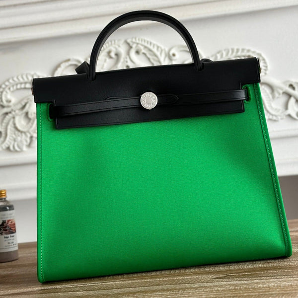 ZIP CABINE 31 TASCHE AUS SMARAGDGRÜNEM CANVAS UND SCHWARZEM KALBSLEDER