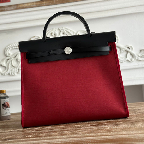 ZIP CABINE 31 TASCHE AUS RUBINROTEM CANVAS UND SCHWARZEM KALBSLEDER