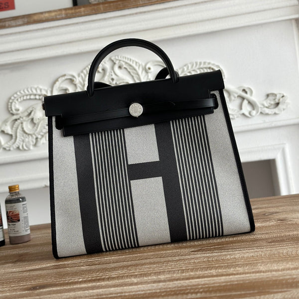 ZIP CABINE 31 TASCHE AUS SCHWARZEM MIX AUS WEISSEM CANVAS UND KALBSLEDER